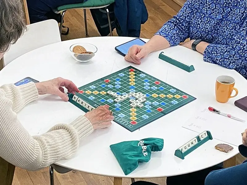 Centrepoint members playing a game of Scrabble