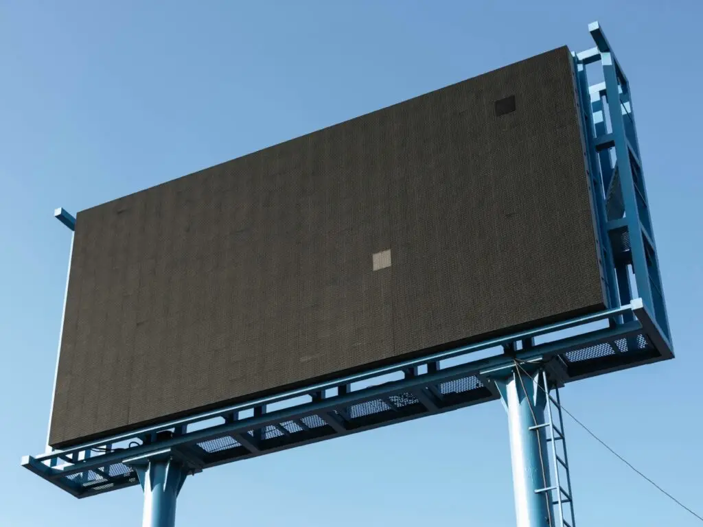 A large empty black billboard